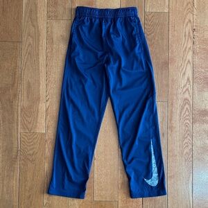 Nike Dri-Fit boys navy blue athletic pants size M with pockets.